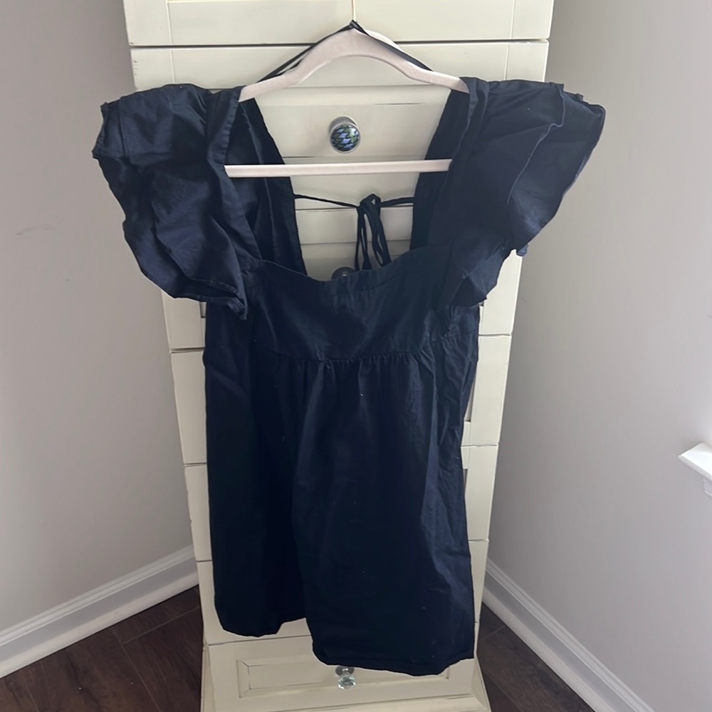 Black top, or dress depending on heigh. Size L